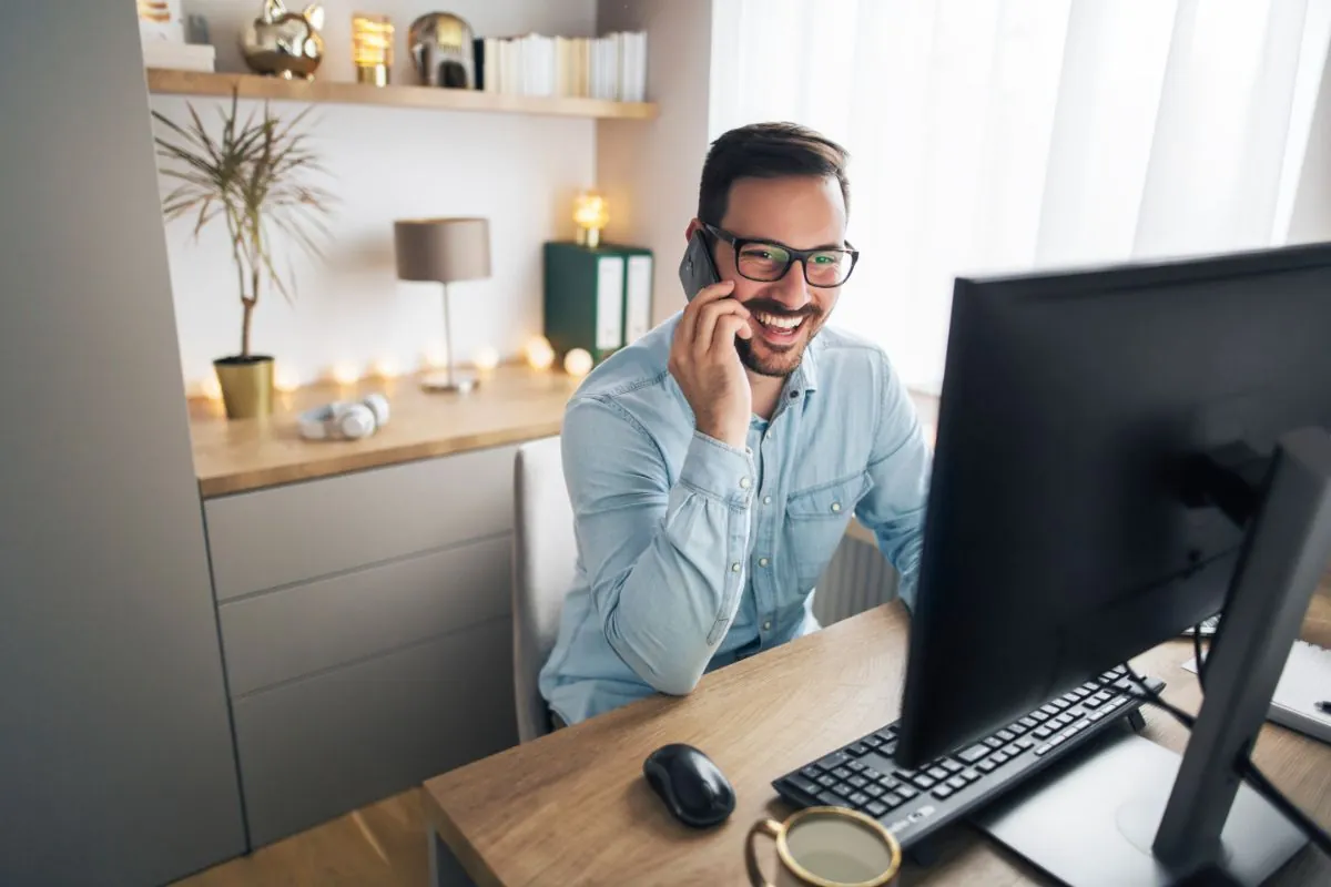 a man working remotely from home office