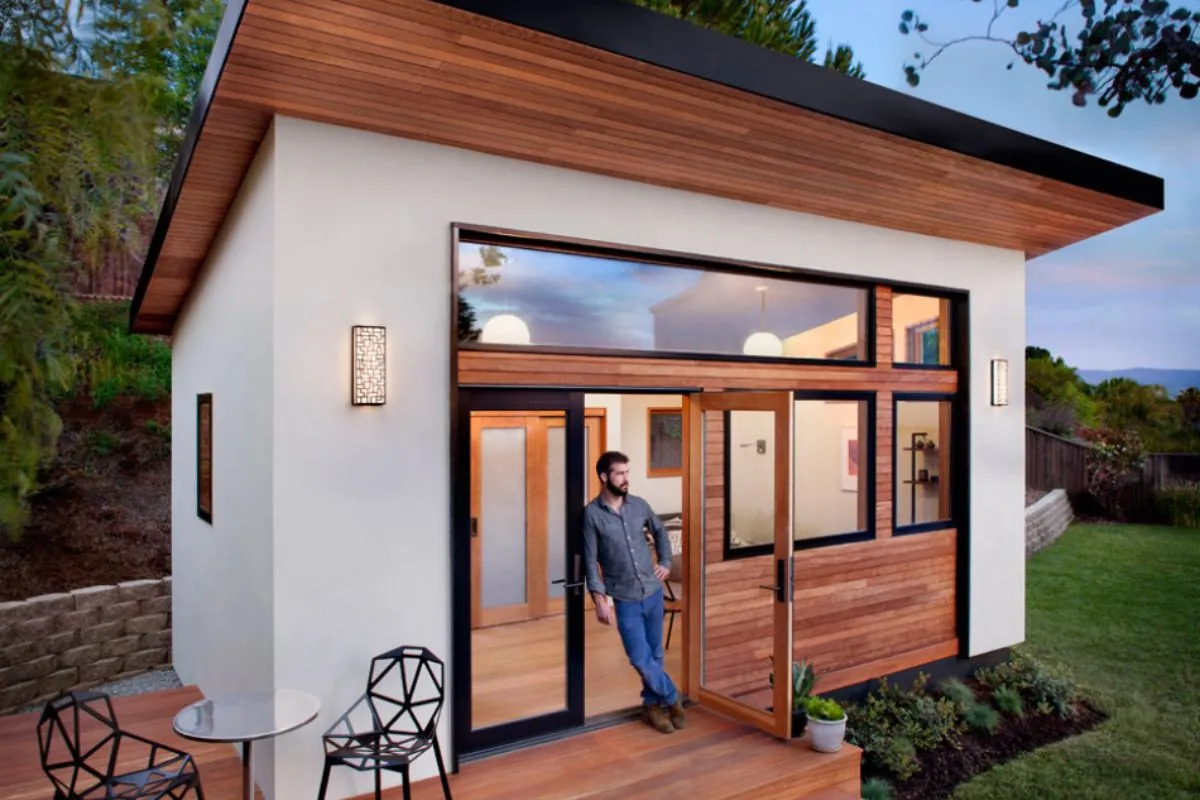 a man standing on front door of accessory dwelling units