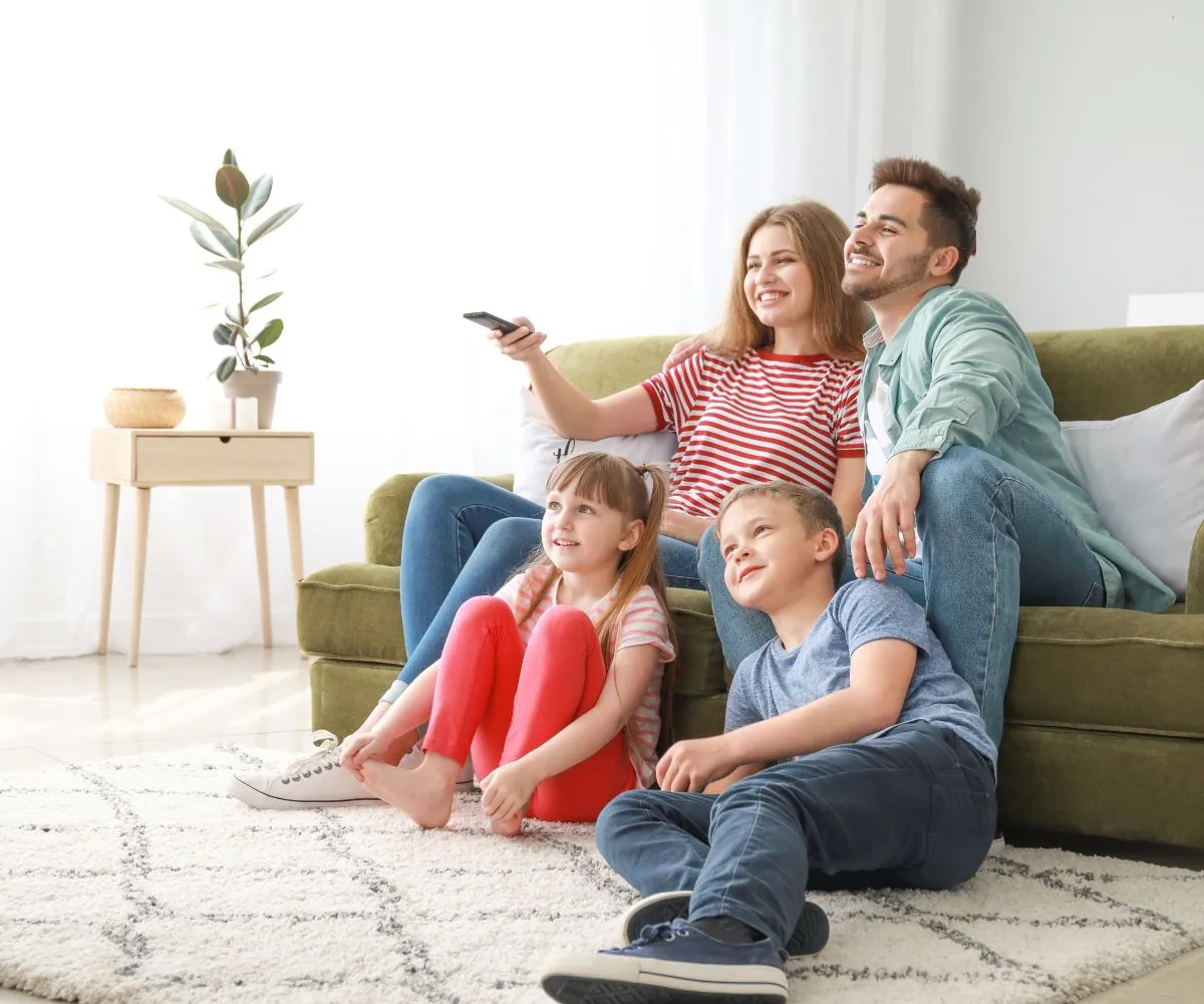 happy family watching tv at home