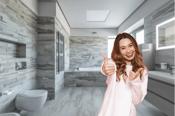 woman thumbs up for bathroom remodel