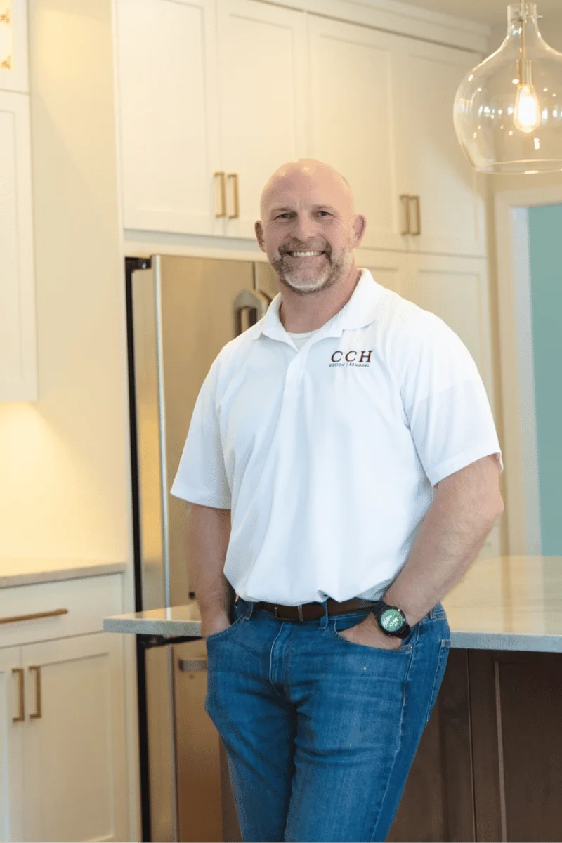 Mike hill standing in the kitchen Island