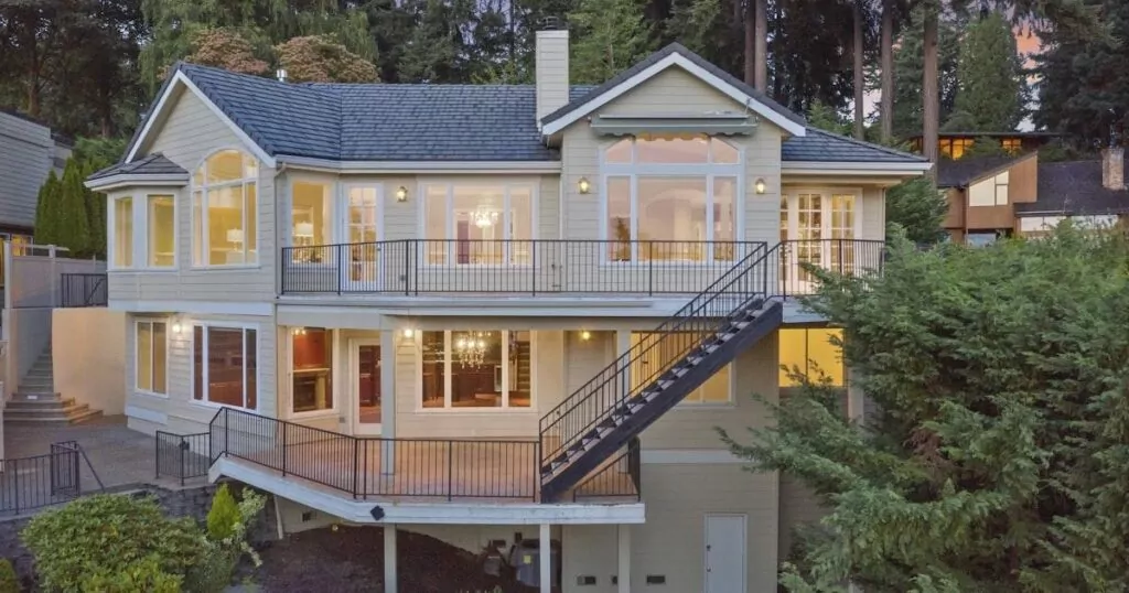 Completed two-story white residential home in a neighborhood setting
